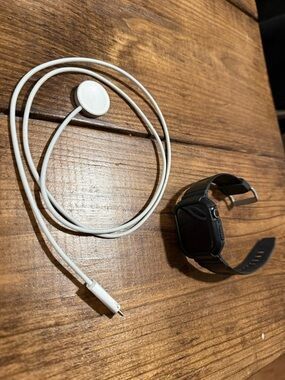 Apple Smartwatch Black with White Charger Cable